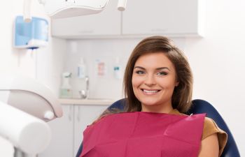 Relaxed Smiling Woman in Dental Chair