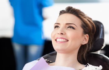 relaxed woman in a dental chair before a dental procedure