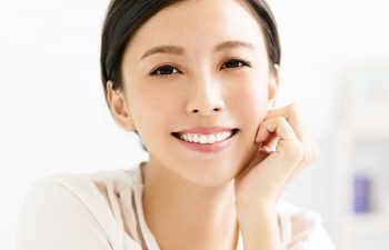 young Asian woman with perfect smile