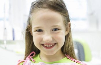 Cheerful little girl at a pediatric dentist office Marietta, GA