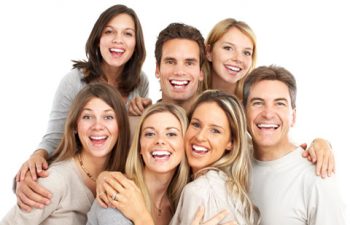group of seven smiling friends with perfect teeth
