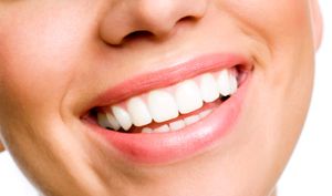 beautiful smile with perfect teeth after cosmetic procedures