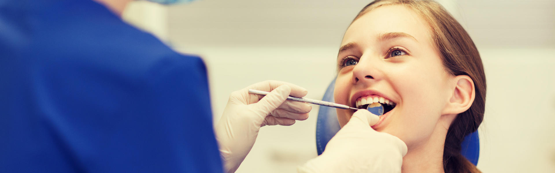 Girl in a dental chair during a dental checkup