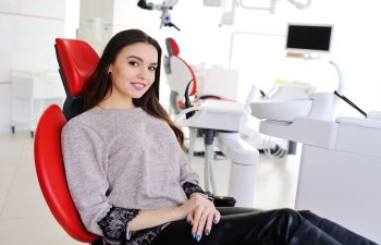 young woman in a dental chair waiting for a dentist